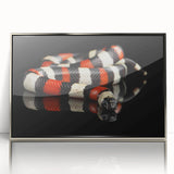 Framed acrylic wall art featuring a striking snake design with silver accents, perfect for reptile enthusiasts, displayed against a neutral background.