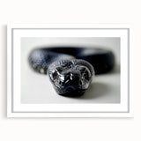 Framed wall art featuring a detailed snake design, set against a white mat and frame, perfect for reptile lovers and modern decor enthusiasts.