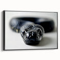 Framed wall art featuring a striking snake design on a textured canvas, showcasing vibrant colors against a sleek black background, perfect for reptile enthusiasts.