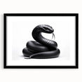 Framed wall art featuring a striking reptile and snake design with a black matte finish, perfect for enhancing modern decor in living spaces.