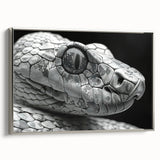 Framed wall art featuring a sleek silver snake design on canvas, showcasing intricate details and textures, perfect for reptile enthusiasts and modern decor.
