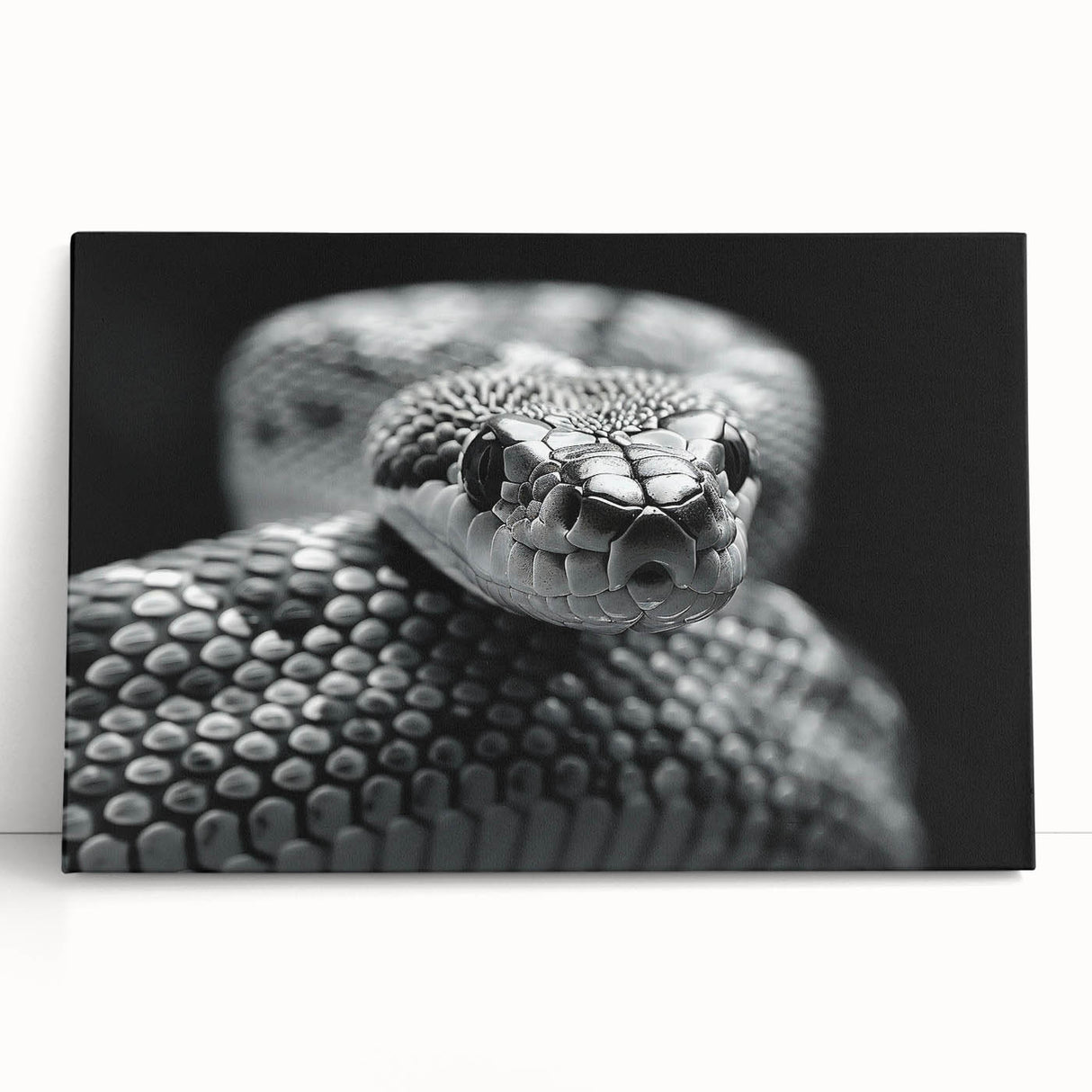 Stretched canvas wall art featuring a vibrant snake design in shades of green and black, leaning against a neutral wall, perfect for reptile enthusiasts' decor.