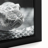 Close-up of a framed canvas wall art featuring a vibrant snake design with intricate patterns and rich colors, ideal for reptile enthusiasts and modern decor.