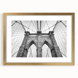 Textured abstract art print in muted gold and beige tones on a framed canvas, ideal for bedroom ambiance.