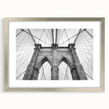 Abstract art print featuring swirling blue and gray tones on a framed canvas, suitable for dining room or bedroom decor.