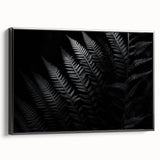 Black-framed canvas wall art showcasing a vibrant abstract design, angled to highlight its depth and texture, perfect for modern home decor accents.