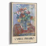 Framed canvas of Camille Pissarro's landscape painting featuring a colorful rural scene.