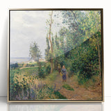 Large art print of a Camille Pissarro painting, featuring a rural landscape in muted earth tones on a gold-framed acrylic.