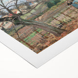 Art deco poster featuring a bustling city scene in muted gold and black tones on rolled canvas.