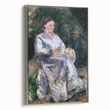 Framed canvas of a Camille Pissarro landscape painting with colorful details, ideal for vintage-style living room decor.