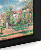 Close-up of a framed canvas featuring Camille Pissarro's impressionist painting.