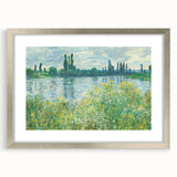 Textured art print of a Claude Monet-inspired landscape in muted greens and blues, framed in silver, ideal for bedroom decor.