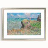 Textured art print of a Claude Monet painting, featuring soft pastel hues on a framed silver mat, ideal for bedroom decor.