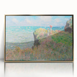 Large art print of Claude Monet’s impressionist painting in gold frame, featuring soft pastel colors.