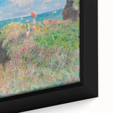 Close-up of a textured Claude Monet-inspired painting on black framed canvas, featuring a blend of vibrant colors.