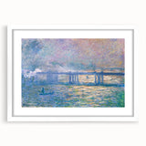 Abstract art print of a Claude Monet-inspired water lily scene in soft blue and green tones, framed in white.