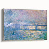 Framed canvas of a Claude Monet landscape painting featuring colorful foliage and a pond.
