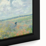 Close-up of a textured Claude Monet painting on a framed canvas, featuring vibrant floral elements.