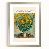 Textured art print of an abstract Claude Monet design in silver frame, featuring soft blue and green hues.