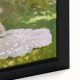 Close-up of a textured Claude Monet painting reproduction on framed canvas, featuring vibrant, colorful brush strokes.