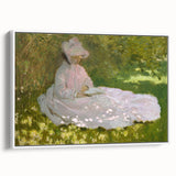 Framed canvas of Claude Monet's vintage poster art featuring colorful, impressionistic water lilies on a black background.