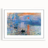Abstract art print of a blurred landscape in muted green and blue, framed in white, ideal for dining room decor.
