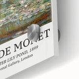 Large abstract wall art by Claude Monet in muted greens and blues on acrylic glass, ideal for dining room ambiance.