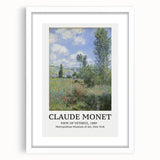 Abstract art print of a Claude Monet painting in a white frame, featuring soft pastel hues.