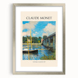 Textured abstract art print of a Claude Monet design in muted green and blue, framed in silver, ideal for bedroom decor.