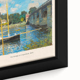 Close-up of a textured Claude Monet painting reproduction on framed canvas, featuring vibrant color splashes.