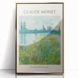 Large art print of a Claude Monet painting in a gold frame, featuring soft pastel colors and impressionist style.