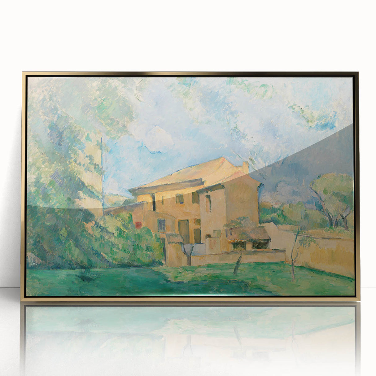 Large art print of a Paul Cezanne landscape in muted greens and blues, framed in gold acrylic.