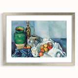 Textured art print of abstract shapes in muted green and blue, framed in silver, suitable for bedroom decor.