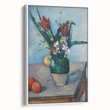 Vintage poster art of a Paul Cézanne painting on a framed canvas, featuring colorful art in a black frame.