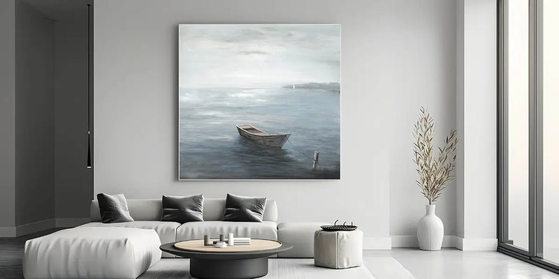 Tranquil landscape wall art featuring a small wooden boat on calm ocean water under a soft cloudy sky in a minimalist style