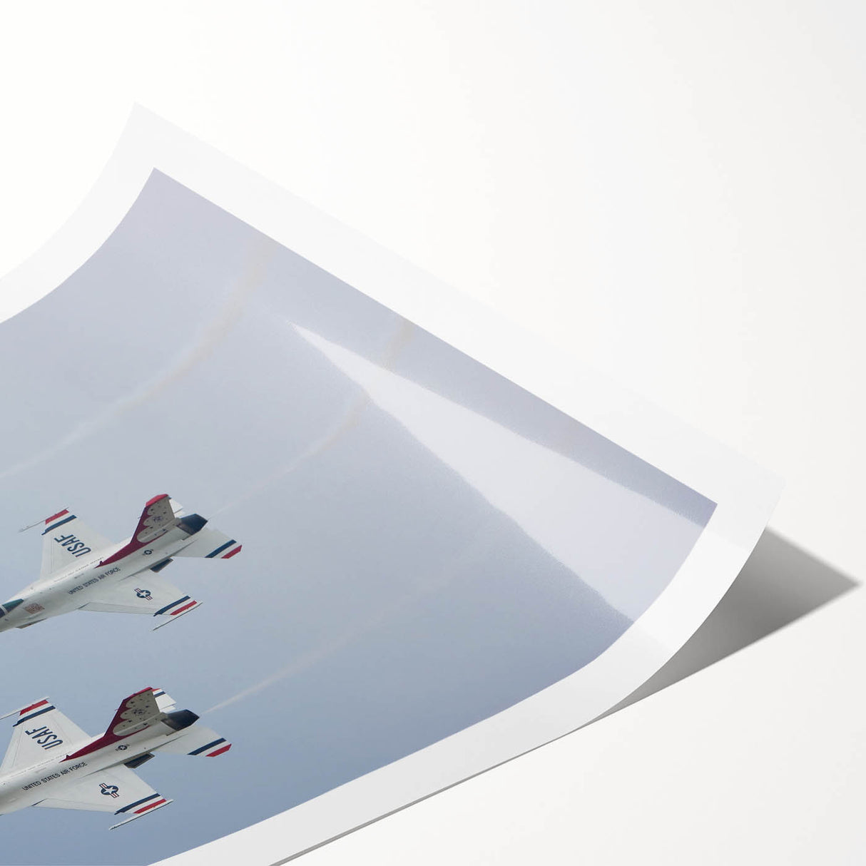 Large rolled print of an abstract airplane design in muted gray and blue tones, suitable for modern bathroom decor.