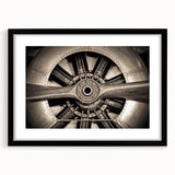 Abstract art print featuring a colorful, textured airplane design on an extra-large black-framed canvas.