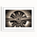 Extra large abstract art print of a textured airplane, in muted gray tones, framed with a white mat.