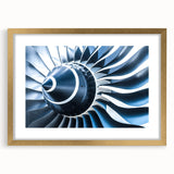 Abstract art print of an airplane in shades of blue and gray on a framed canvas, suitable for bedroom or dining room decor.