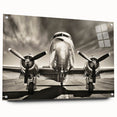 Side view of an airplane depicted in large abstract wall art on acrylic glass, featuring neutral and gray tones.