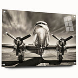 Side view of an airplane depicted in large abstract wall art on acrylic glass, featuring neutral and gray tones.