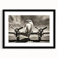 Abstract art print of colorful airplanes in a textured style on black framed canvas.