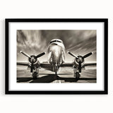 Abstract art print of colorful airplanes in a textured style on black framed canvas.