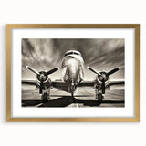 Abstract art print of an airplane in gold and black tones on a framed canvas, suitable for bedroom or dining room decor.