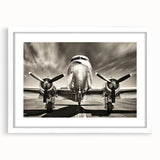 Extra large abstract art print of an airplane, in muted gray tones on a white framed canvas, ideal for living room decor.
