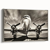 Framed canvas featuring a vintage airplane against a muted black and colorful landscape, perfect for an office or study.