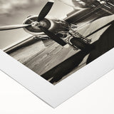 Art deco poster of a vintage airplane in muted metallic tones on rolled canvas, suitable for dining room wall art.