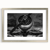Abstract art print of airplanes in muted gray and blue tones on a framed poster, ideal for modern bedroom ambiance.