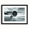 Abstract art print of colorful airplanes in textured style on extra large black-framed canvas, ideal for living room decor.