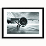 Abstract art print of colorful airplanes in textured style on extra large black-framed canvas, ideal for living room decor.